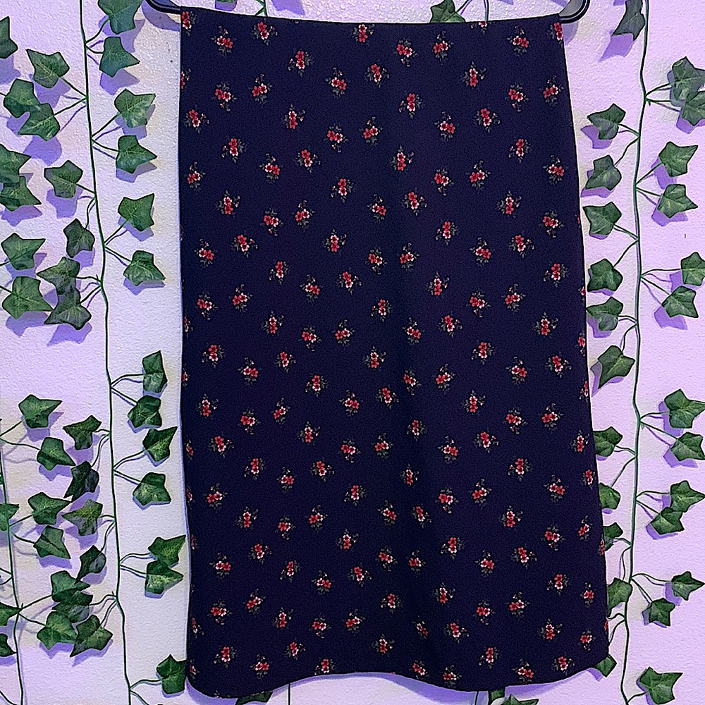Modest black skirt with red flowers.